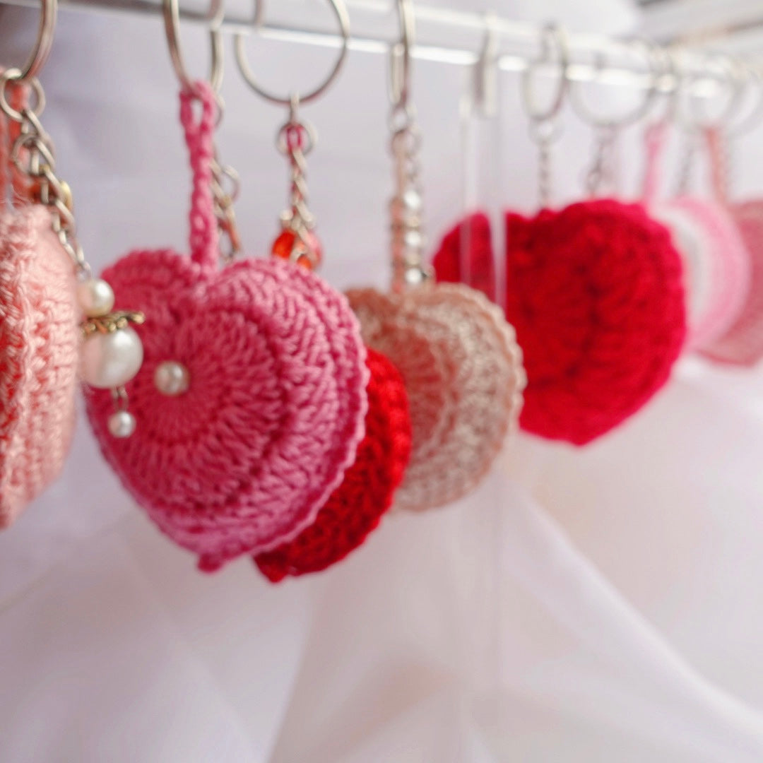 crochet heart keychains pink white ivory red crochet accessories handmade sincerely herrera located in chicago IL cute accessories for bags and keys cute gift ideas valentines day accessories pearl hearts crochet pattern