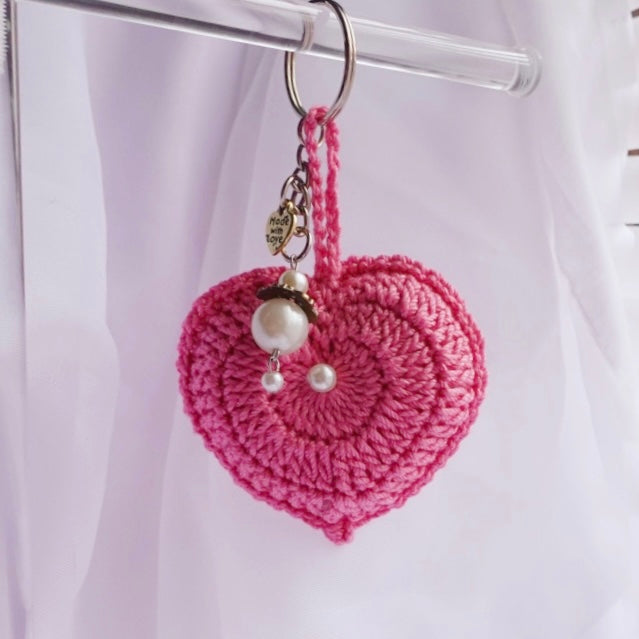 crochet heart keychains pink white ivory red crochet accessories handmade sincerely herrera located in chicago IL cute accessories for bags and keys cute gift ideas valentines day accessories pearl hearts crochet pattern