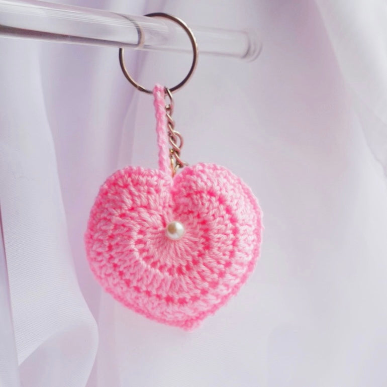 crochet heart keychains pink white ivory red crochet accessories handmade sincerely herrera located in chicago IL cute accessories for bags and keys cute gift ideas valentines day accessories pearl hearts crochet pattern