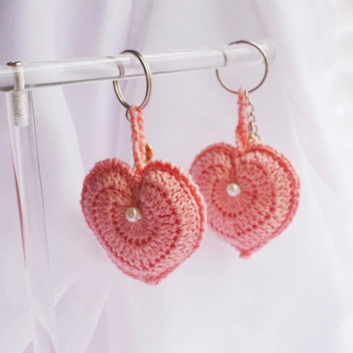 crochet heart keychains pink white ivory red crochet accessories handmade sincerely herrera located in chicago IL cute accessories for bags and keys cute gift ideas valentines day accessories pearl hearts crochet pattern