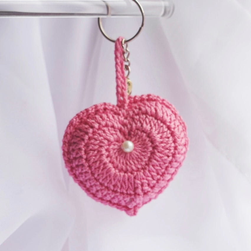 crochet heart keychains pink white ivory red crochet accessories handmade sincerely herrera located in chicago IL cute accessories for bags and keys cute gift ideas valentines day accessories pearl hearts crochet pattern