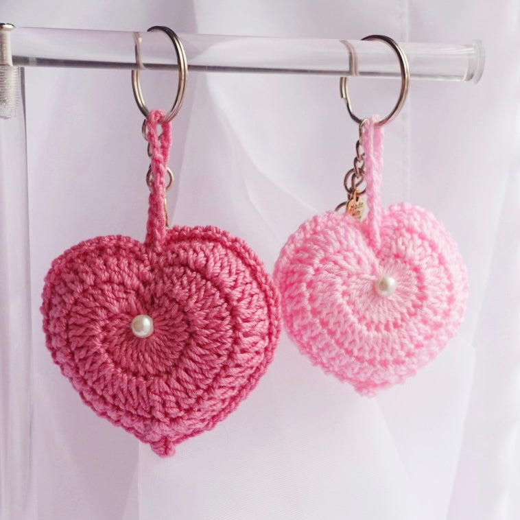 crochet heart keychains pink white ivory red crochet accessories handmade sincerely herrera located in chicago IL cute accessories for bags and keys cute gift ideas valentines day accessories pearl hearts crochet pattern