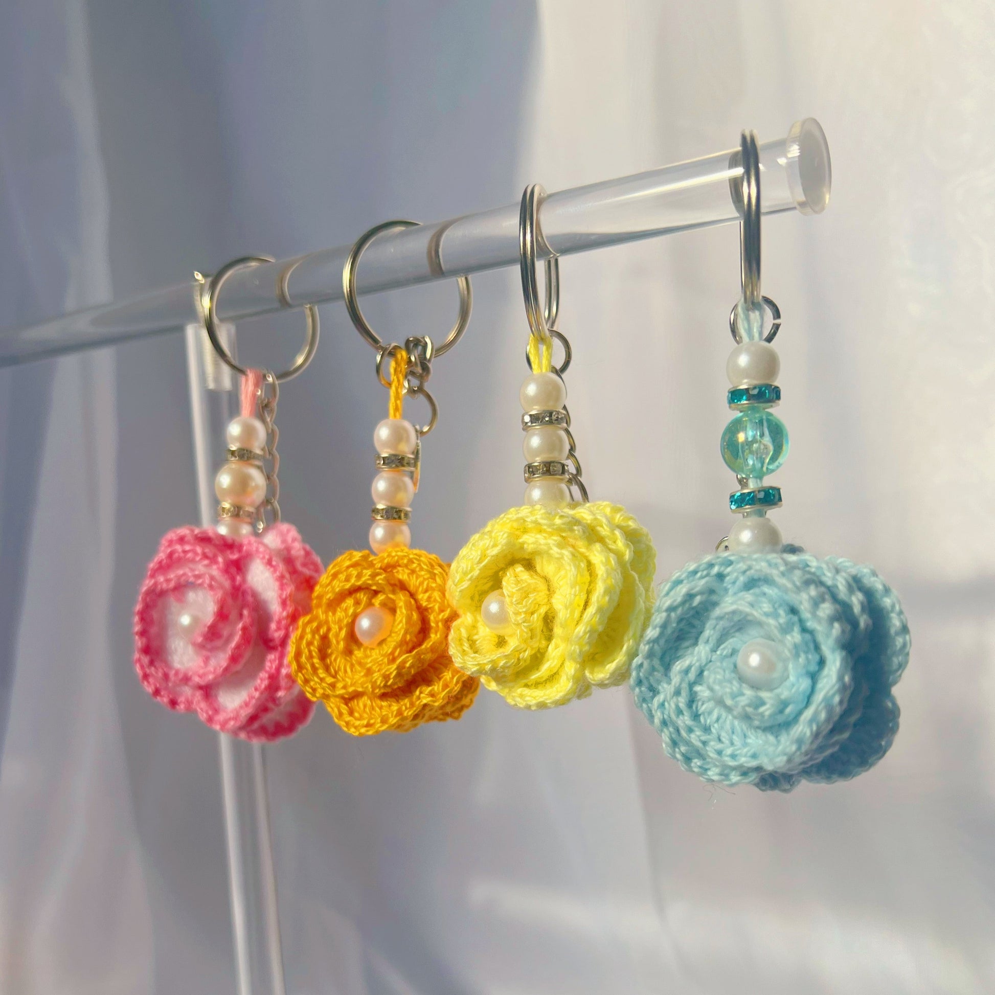 handmade mini crochet flower keychains cute accessories gift ideas eternal flowers handmade sincerely herrera pink yellow blue orange roses coral baby blue purple flower keychains handmade in chicago il