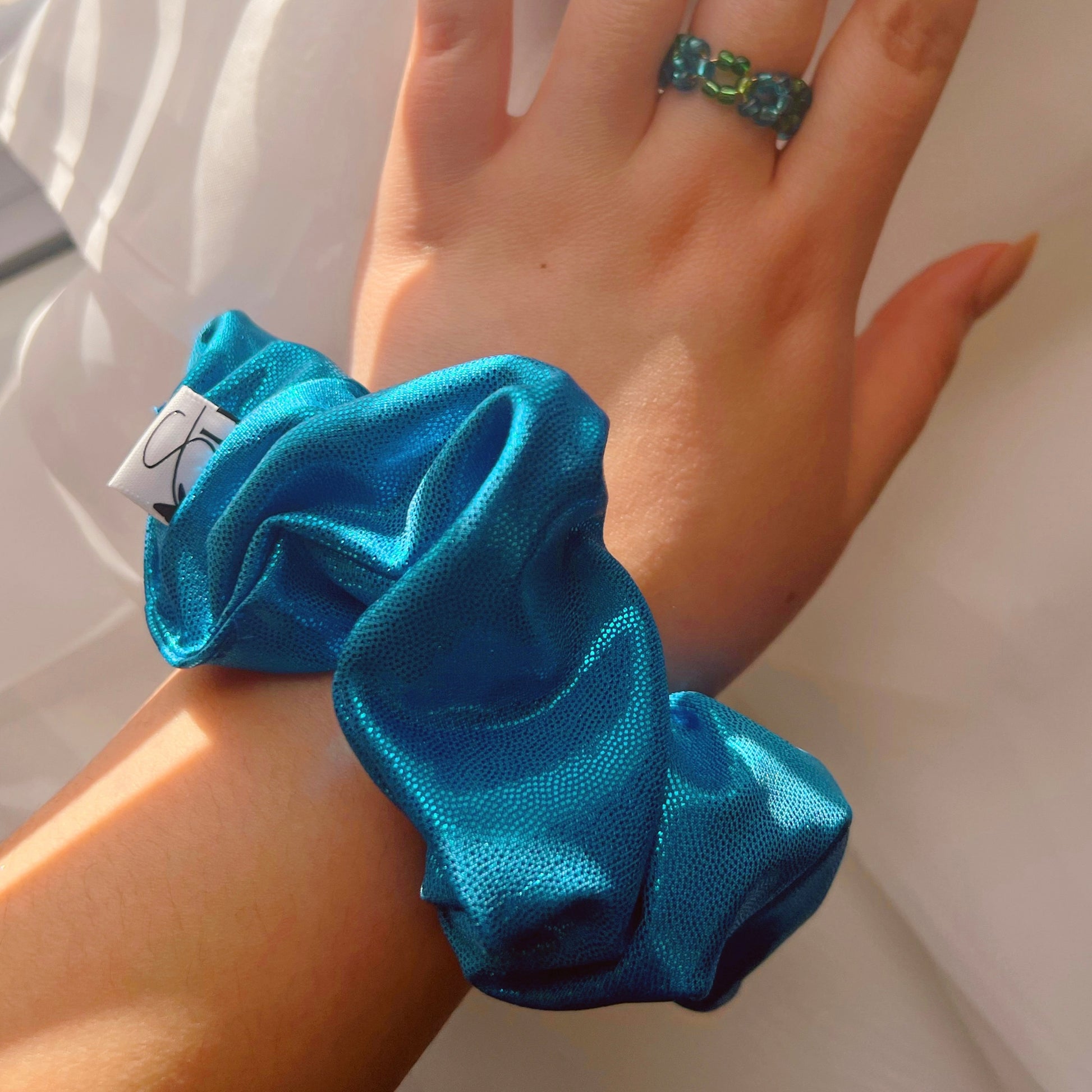 shiny-scrunchies-handmade-hair-accessories-for-everyone-blue-hairties-women-owned-business-daily-cute-accessories-perfect-handmade-gifts-scrunchies-hair-accessory-handmade-shop-blue-hairties-spring-accessories-sincerely-herrera-gifts-for-her-gifts-for-everyone-holographic-scrunchie-daily-hairstyle-inspo-aesthetic-pinterest